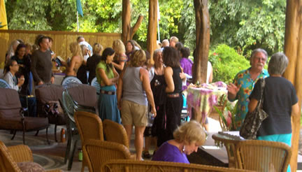 Attendees socializing and buying books.